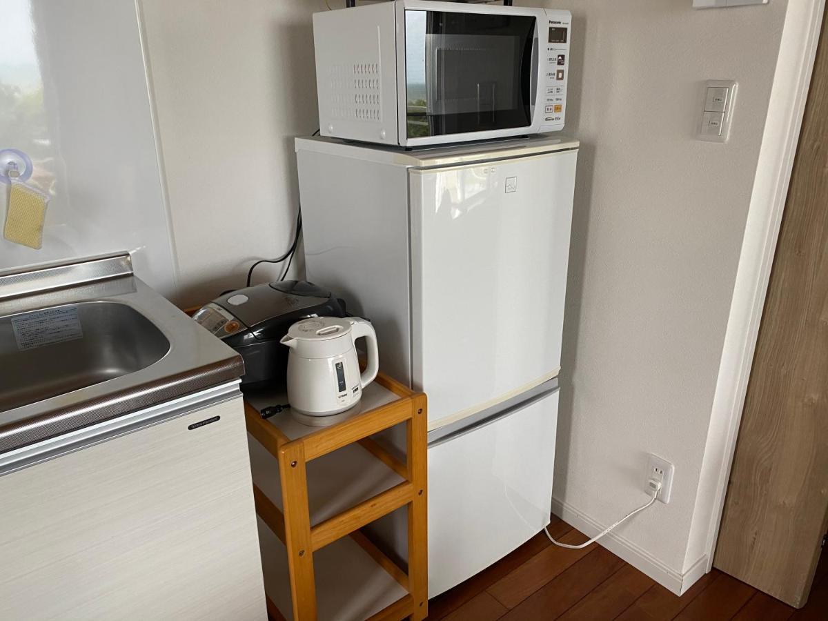 Ocean Front SUMUIDE Appartement Nago Buitenkant foto