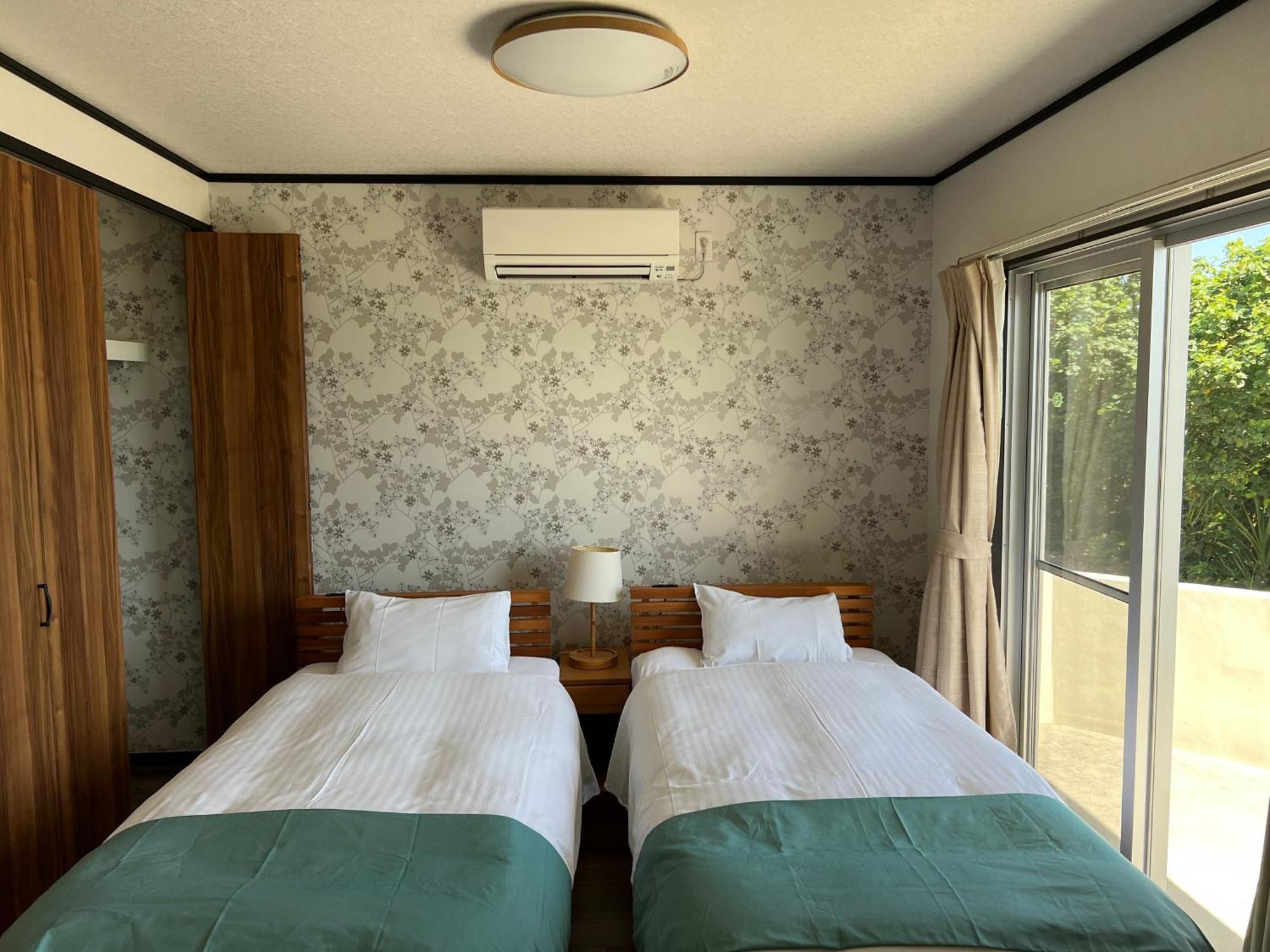 Ocean Front SUMUIDE Appartement Nago Buitenkant foto